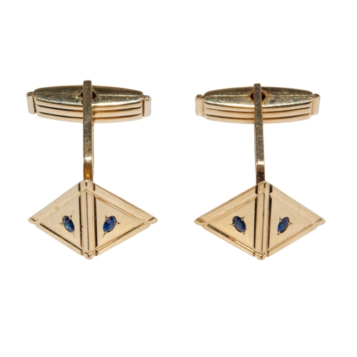 65 - ContinentalCirca 1950A pair of sapphire and yellow metal pyramid cufflinksStamped '14K'Weight: Appro... 