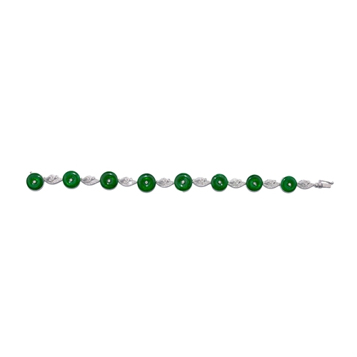 79 - South East AsianCirca 1990A very fine Imperial jadeite, diamond and white gold braceletComposed of e... 