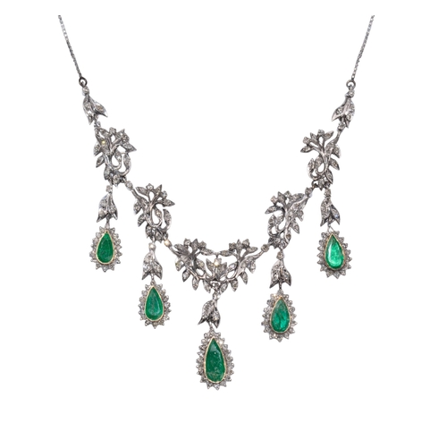 81 - Middle EasternCirca 1960An emerald and diamond necklace and earringsThe foliate scroll necklace set ... 