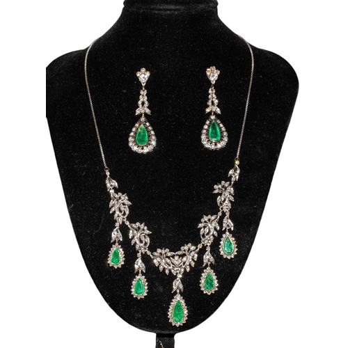 81 - Middle EasternCirca 1960An emerald and diamond necklace and earringsThe foliate scroll necklace set ... 