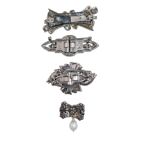 90 - Art DecoCirca 1940A group of silver and paste broochesA silver and paste double clip broochTogether ... 