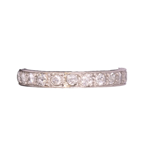 94 - BritishCirca 1920A diamond and platinum hoop ringComprising a row of old brilliant cut diamondsRing ... 