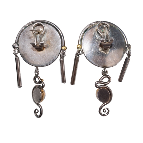 99 - Christoph BlumContemporaryA pair of silver, 24 carat gold and moonstone ear clipsDimensions:6 cm. (L... 