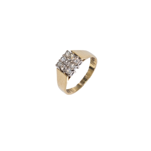 102 - BritishCirca 1970A small diamond and 18 carat yellow gold dress ringThe square shaped top set with n... 