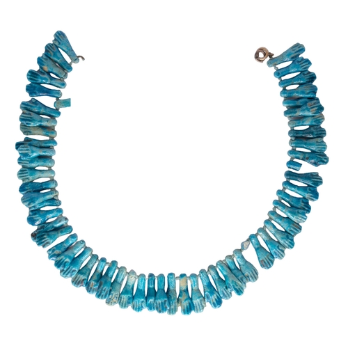 112 - EgyptianProbably AncientA turquoise blue faience bead fringe necklaceDesigned as a line of hand and ... 