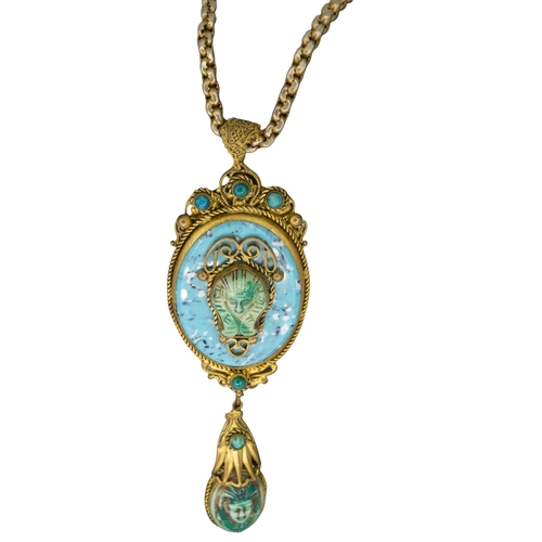 114 - Egyptian RevivalEarly 20th CenturyA turquoise glass and gilt metal pendant necklace