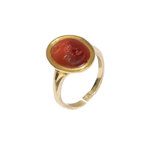 116 - Ancient Roman2nd-3rd Century ADA carnelian intaglio and yellow gold ringThe intaglio carved with the... 