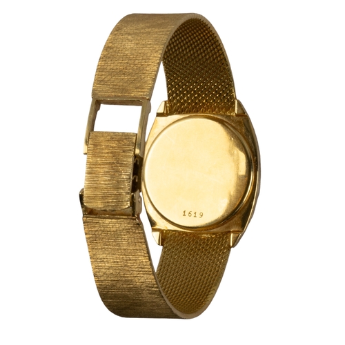 120 - DelanoSwissCirca 1970An 18 carat gold lady's bracelet wristwatchThe circular dial with brushed gold ... 