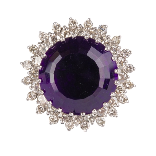 126 - BritishCirca 1980A large amethyst, diamond and 18 carat white gold dress ringSet to the centre with ... 