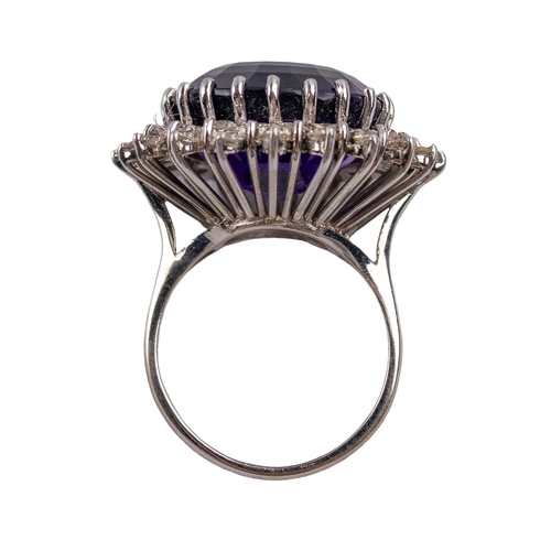 126 - BritishCirca 1980A large amethyst, diamond and 18 carat white gold dress ringSet to the centre with ... 