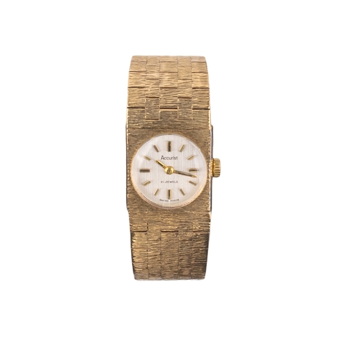 128 - AccuristBritishCirca 1970A 9 carat gold bark finished lady's bracelet wristwatchWeight: Approx. 39.1... 