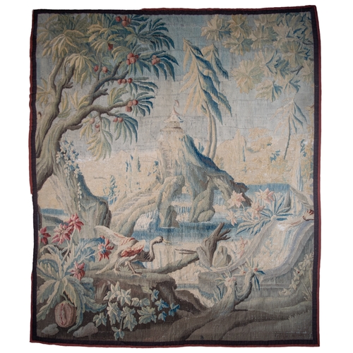 291 - FrenchEarly 18th CenturyA large verdure chinoiserie Aubusson tapestryWith an exotic bird in a river ... 