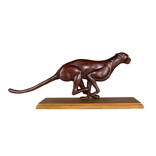 303 - 20th CenturyRunning JaguarBronze on a wood baseDimensions:11 in. (H) x 28 in. (L) x 6 in. (W) (inclu... 