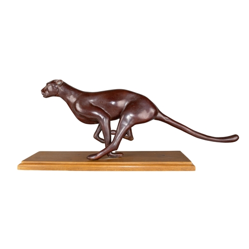 303 - 20th CenturyRunning JaguarBronze on a wood baseDimensions:11 in. (H) x 28 in. (L) x 6 in. (W) (inclu... 