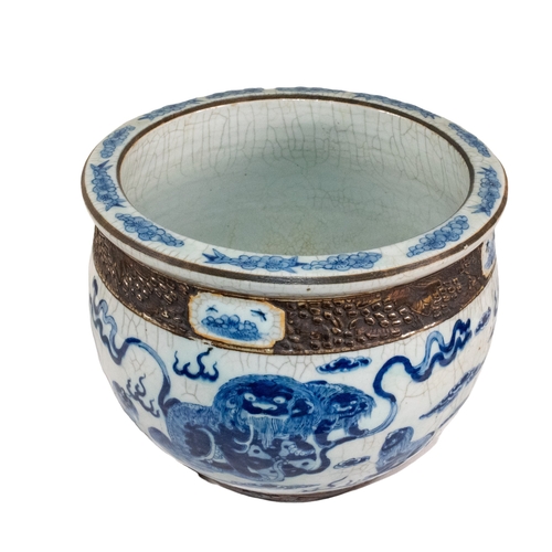 638 - ChineseA blue and white crackle glazed jardinièreDecorated with Chinese dragons between bronz... 