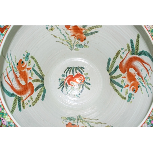 651 - Chinese20th CenturyA massive Canton style fish bowlDecorated with floral, fish and courtly motifsDim... 