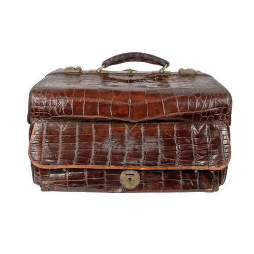 660A - 20th CenturyA crocodile leather vanity travel case with silver engraved and cut rock crystal persona... 