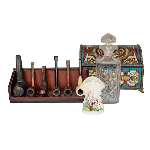 669 - 20th CenturyAn eclectic selection of objets[a] A cut glass decanter[b] Five tobacco pipes, with a le... 