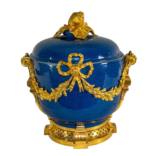 677 - French19th/20th centuryLouis XVI styleA gilt bronze mounted blue ground porcelain bowl and coverThe ... 