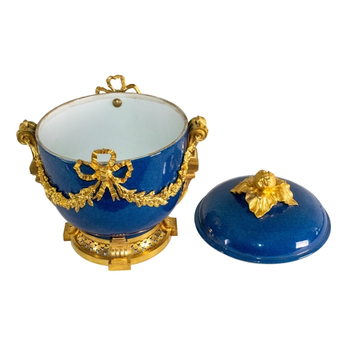 677 - French19th/20th centuryLouis XVI styleA gilt bronze mounted blue ground porcelain bowl and coverThe ... 