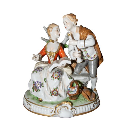 697 - Two German porcelain groupsEarly 20th centuryPrinted marksOne with a young couple holding sheet musi... 