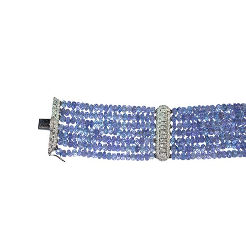 33 - ContinentalCirca 1990An attractive sapphire bead and diamond braceletThe bracelet composed of 7 rows... 