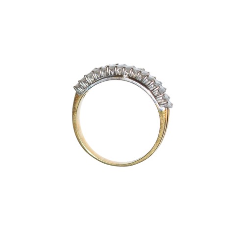 88 - BritishCirca 1990A baguette cut diamond and 18 carat gold half hoop ringRing size: PWeight: Approx. ... 