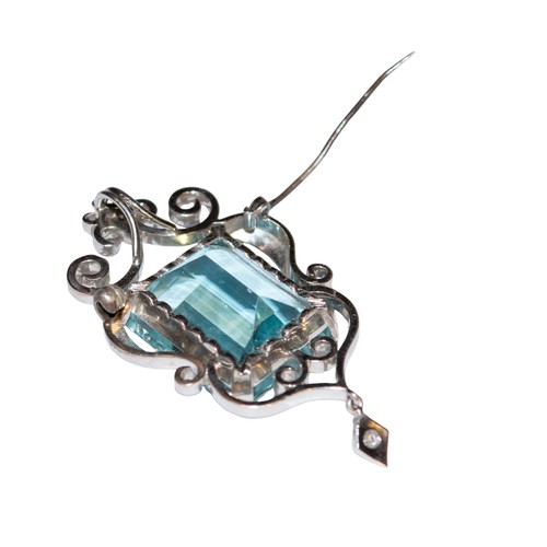 34 - ContinentalCirca 1960A large aquamarine and diamond pendant/broochThe step cut aquamarine of fine co... 