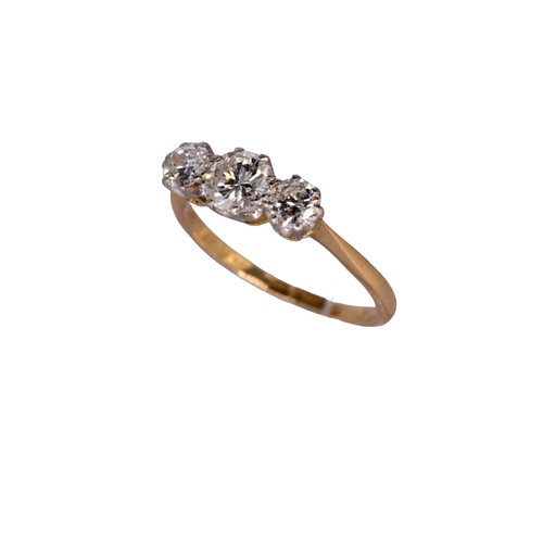 21 - BritishCirca 1936A diamond, yellow gold and platinum three stone ringThe central brilliant cut diamo... 