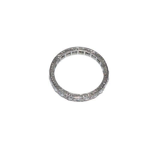 94 - BritishCirca 1920A diamond and platinum hoop ringComprising a row of old brilliant cut diamondsRing ... 