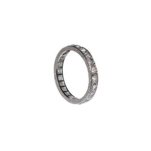 94 - BritishCirca 1920A diamond and platinum hoop ringComprising a row of old brilliant cut diamondsRing ... 