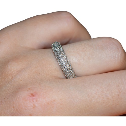 95 - BritishCirca 1990A pavé set brilliant cut diamond half hoop ringMounted in 9 carat white goldRing si... 