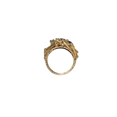 49 - KutchinskyLondonCirca 1970An abstract sapphire and diamond dress ringMounted in 18 carat yellow gold... 