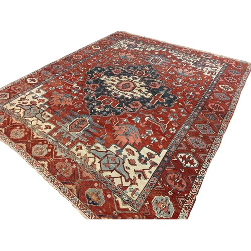 135 - 19th Century, PersianA Serapi carpet in reds and bluesDimensions:145 in. (H) x 122 in. (W)... 