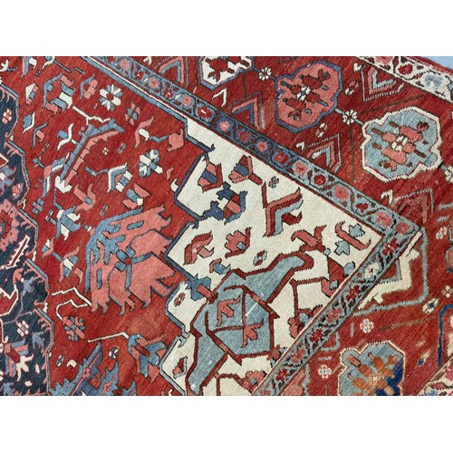 135 - 19th Century, PersianA Serapi carpet in reds and bluesDimensions:145 in. (H) x 122 in. (W)... 