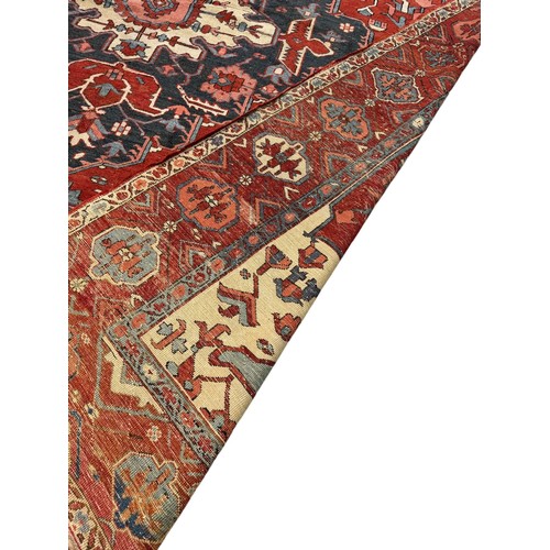 135 - 19th Century, PersianA Serapi carpet in reds and bluesDimensions:145 in. (H) x 122 in. (W)... 