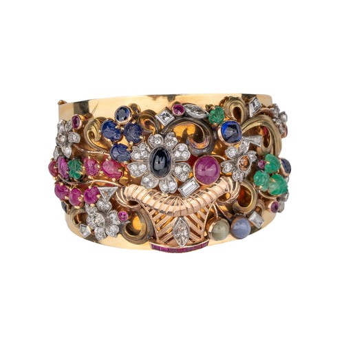 40 - ContinentalArt Deco Circa 1935A striking multi-gem set giardinetto bangleThe wide bangle applied wit... 