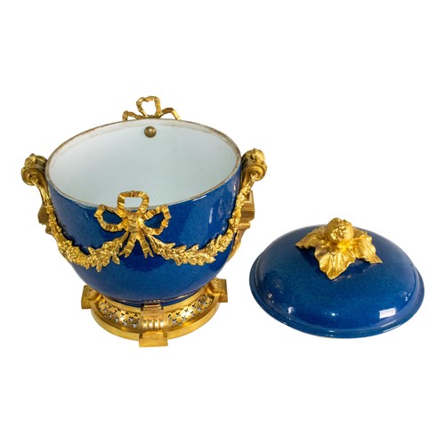 520 - French19th/20th centuryLouis XVI styleA gilt bronze mounted blue ground porcelain bowl and coverThe ... 