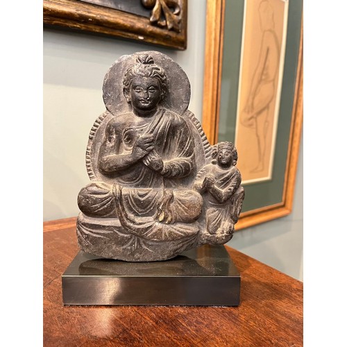 388 - Gandhara2nd Century ADA seated Buddha and devoteeDimensions:9 in. (H) x 5.75 in. (W) x 2.75 in. (D)... 