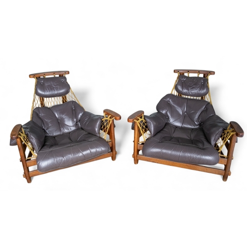 105 - Jean Gillon, Brazilianc.1960sA pair of jangada MCM Brazilian rosewood leather lounge chairs and otto... 