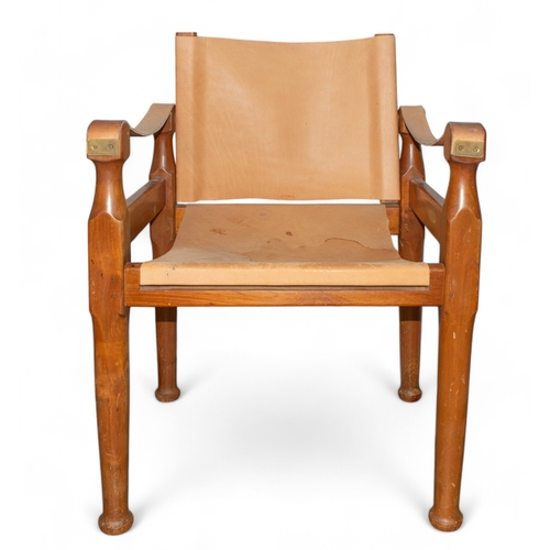 107 - Michael D'Souza MuftiAn Italian teak and tan leather safari chairDimensions:34 in. (H) x 24 in. (W) ... 