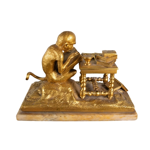 159 - French, 19th CenturyA gilded bronze of a monkey at study with maps of America on a marble baseProper... 