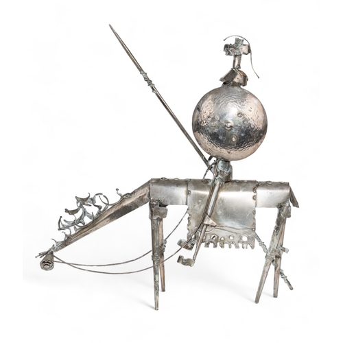 160 - Italian20th CenturyA silver metalwork sculpture of Don Quixote on horsebackDimensions:9.5 in. (H) x ... 