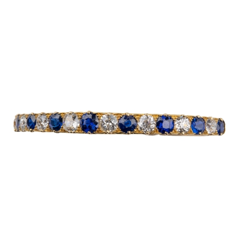 28 - BritishVictorianA fine sapphire and diamond half hoop bangleThe front set with nine slightly graduat... 