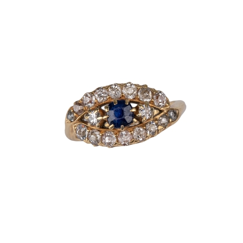 32 - British19th CenturyA sapphire and diamond crossover cluster ringMounted in yellow gold Ring siz... 