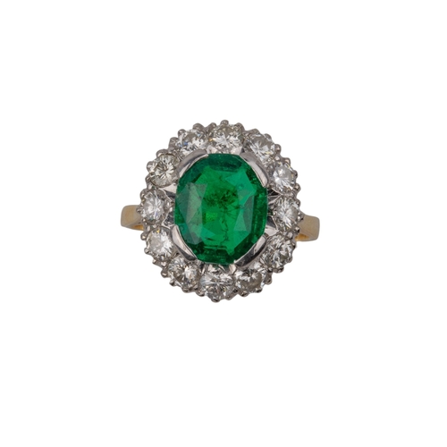 38 - ContinentalCirca 1955A fine emerald and diamond cluster ringThe mixed cut cushion shaped Columbian e... 