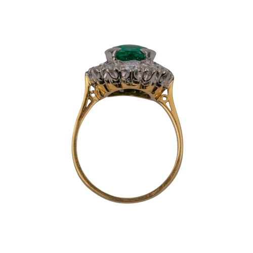 38 - ContinentalCirca 1955A fine emerald and diamond cluster ringThe mixed cut cushion shaped Columbian e... 