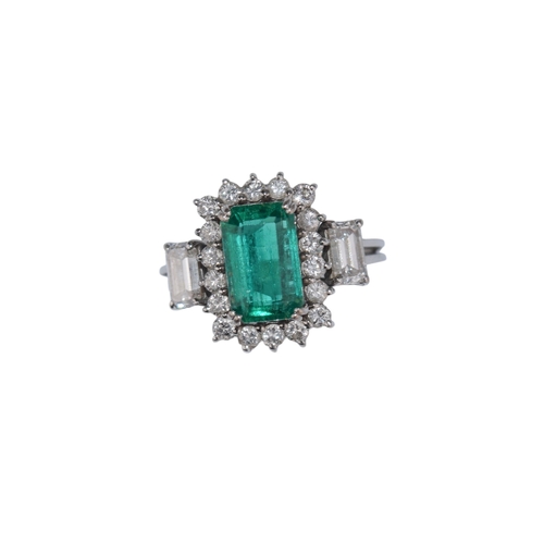 39 - ContinentalCirca 1960A fine Columbian emerald and diamond cluster ringThe rectangular emerald of sup... 