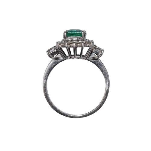 39 - ContinentalCirca 1960A fine Columbian emerald and diamond cluster ringThe rectangular emerald of sup... 