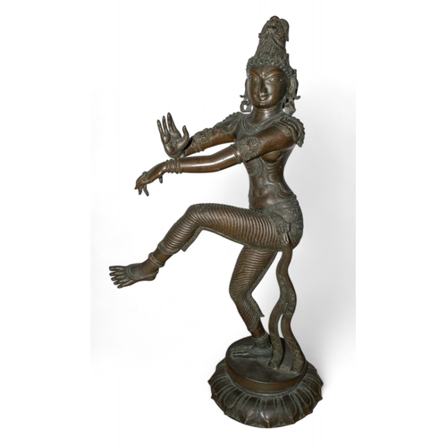 393 - South IndianA large dancing goddess, possibly ParvatiBronzeThe right hand raised in abhaya mudra (gi... 